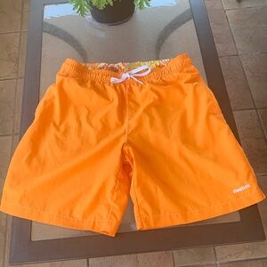 Reebok orange swim trunks.